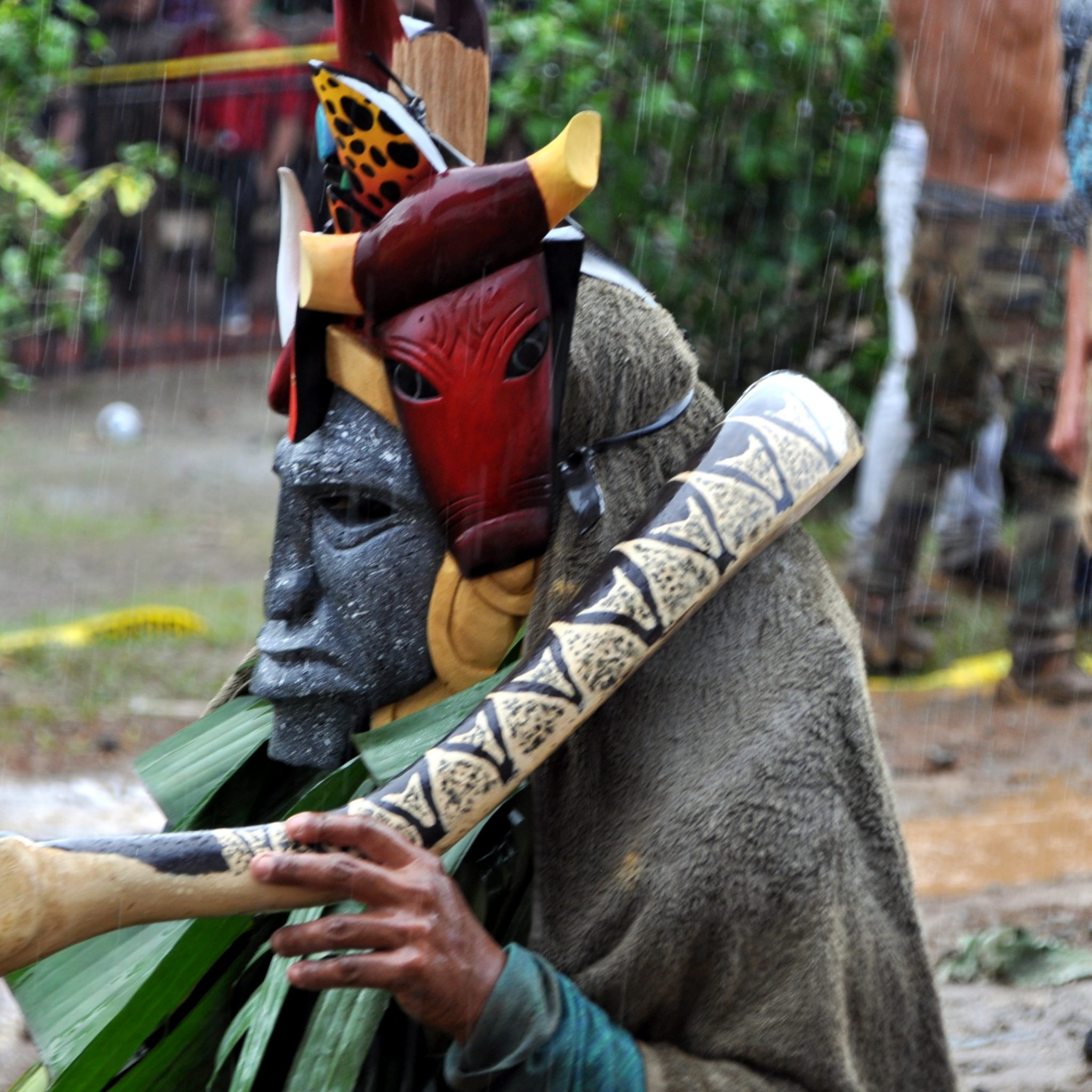 Rain pouring down on meticulously hand painted masks during the 'battle'.